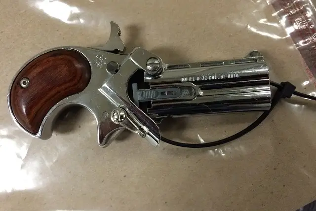 The derringer cops say they found on a man they stopped for drinking in the street in Midtown.